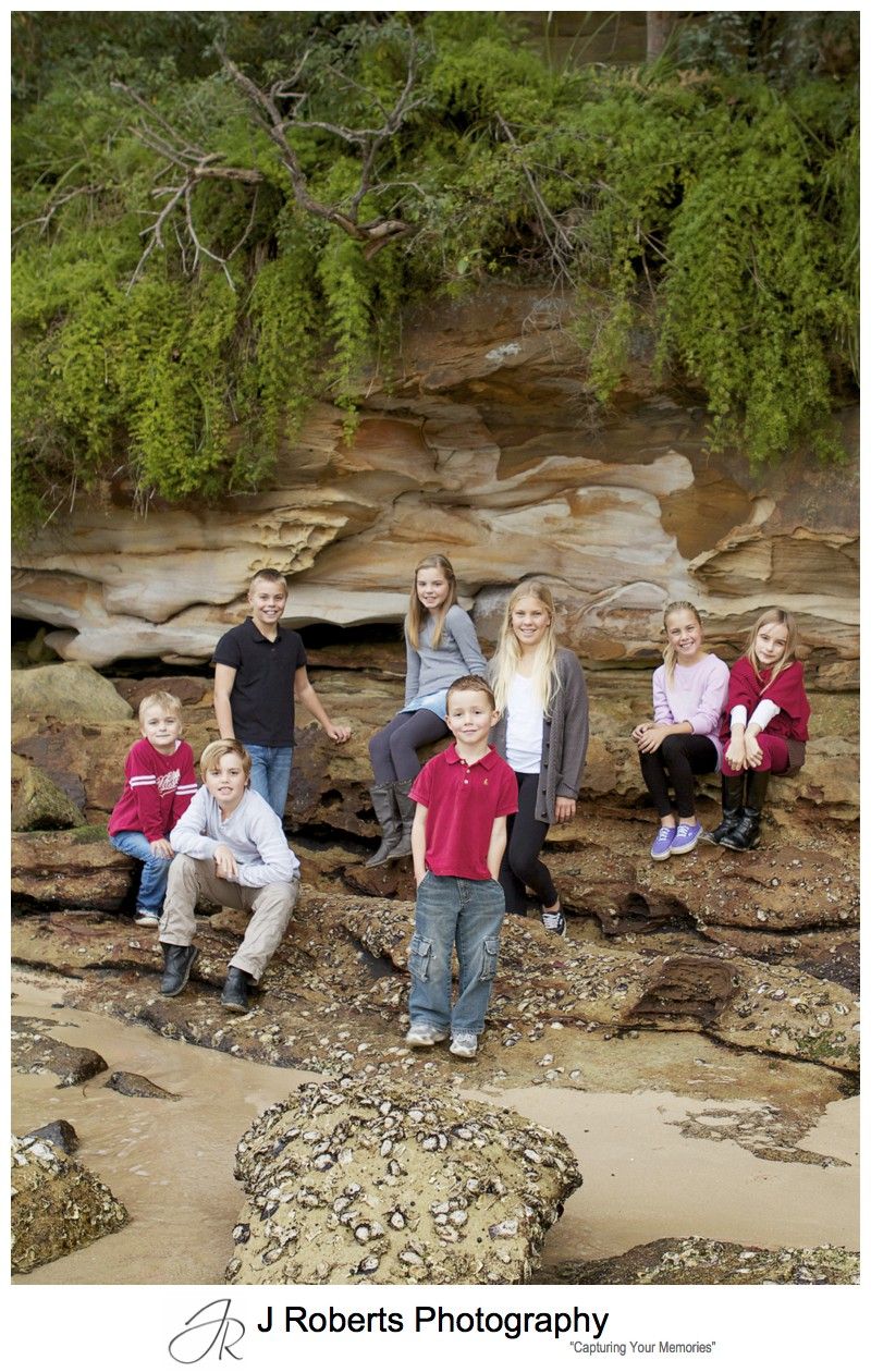 Cousins on the rocks at Clifton Gardens Beach - sydney family portrait photography